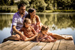 © puhimec - young family on pier near lake