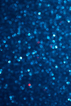 Unfocused Abstract Dark Blue Glitter Bokeh Holiday Background. Winter Xmas Holidays. Christmas.