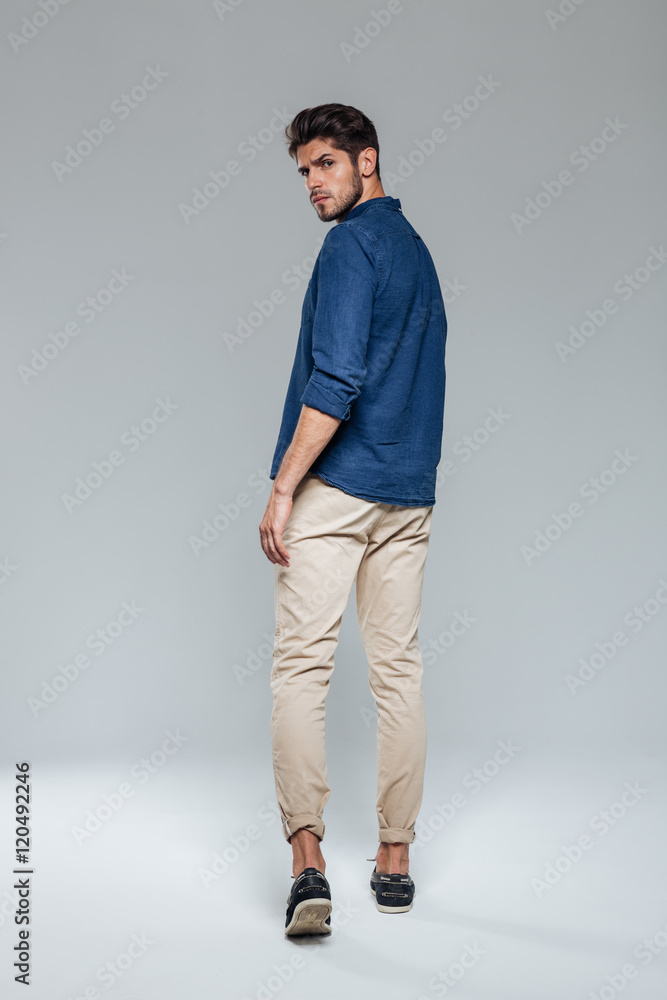 Back view portrait of a casual man walking Stock Photo | Adobe Stock