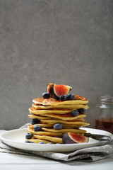 Wall Mural - Pancakes with berries against concrete wall