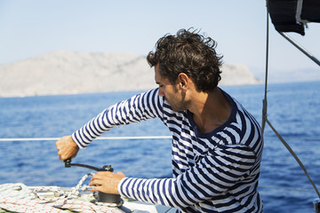 Wall Mural - Man in action of pulling rope