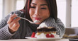 © rocketclips - Japanese woman eating cake at home