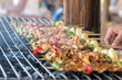 © somchaichoosiri - Grilling shashlik on barbecue grill