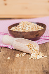 oats in spoon on wood table