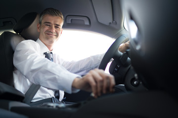 Businessman driving to work