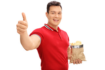 Canvas Print - Guy holding a bag of potato chips