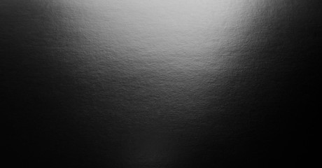 Abstract black background with spotlight