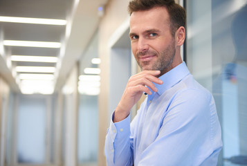 Wall Mural - Thoughtful man in the office corridor