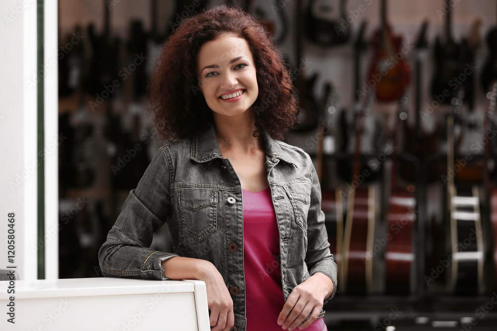 Beautiful girl in music shop
