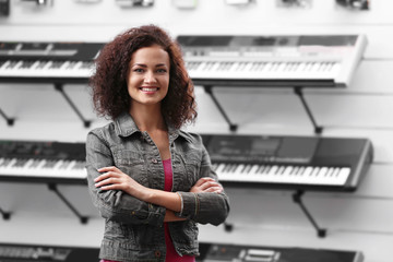 Canvas Print - Beautiful girl in music shop