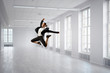 © Sergey Nivens - Dancing businesswoman in office . Mixed media