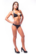 © F8  \ Suport Ukraine - Vivacious sexy young brunette woman with a beautiful smile and  posing in a black bikini  isolated studio portrait