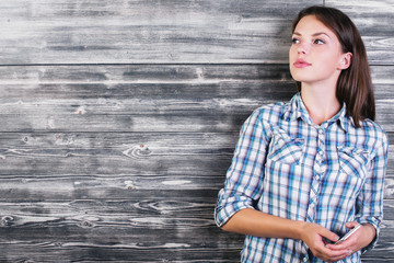 Wall Mural - European woman holding smartphone