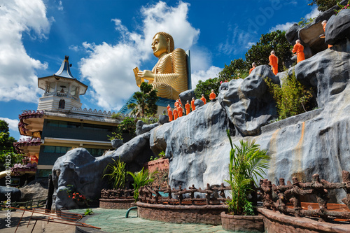 Buddhist monk statues going to Gold Buddha temple