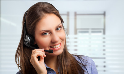 Poster - Portrait of a gorgeous woman using an headset