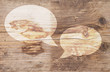 Illustration of white text balloons on brown wooden background