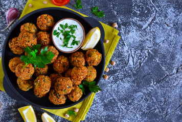 Falafel - deep fried balls of ground chickpeas with tahini sauce