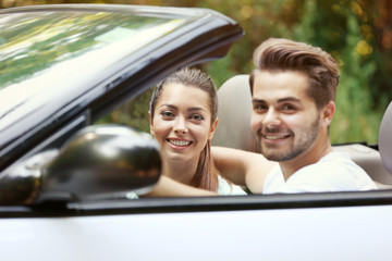 Poster - Beautiful couple in car on road trip