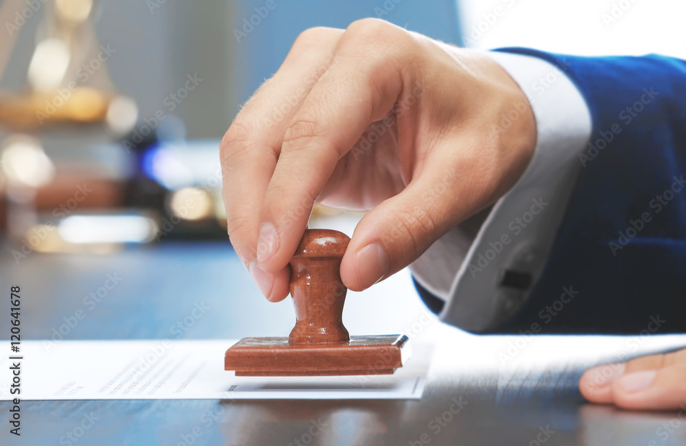 Notary public in office stamping document