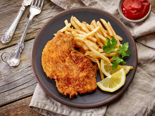 Schnitzel And Fried Potatoes