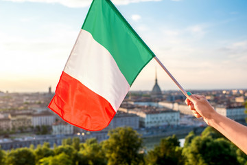 Wall Mural - Italian flag on the Turin cityscape background in Piedmont region in Italy