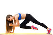 © Mrakor - Concepts: healthy lifestyle, sport. Happy beautiful woman fitness trainer working out with yoga mat isolated on white background