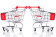 © unclepodger - Two empty shopping carts isolated on white background