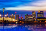 Fototapeta  - The O2 and Canary Wharf from the Royal Victoria Dock at night in London