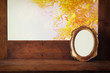 Golden old blank frame on wooden window sill