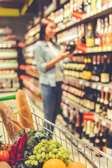 Wall Mural - Girl in the supermarket