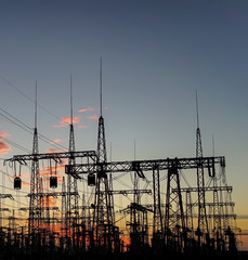 Wall Mural - distribution electric substation pylon with lines, at sunset.