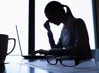 Wall Mural - Businesswoman feeling tired and stressed at work. 