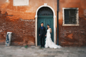 Wall Mural - Young beautiful Asian bride and groom