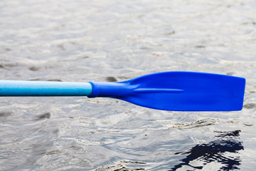 Canvas Print - paddle blade over water during boating