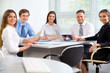 © chagin - Group of business people in office. Businessteam.