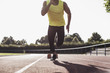 © Westend61 - Runner on tartan track starting