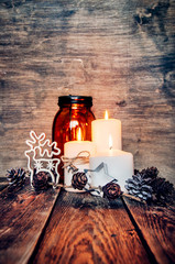 Wall Mural - Christmas background with candle, deer,pine cones and syar.Xmas home decoration.