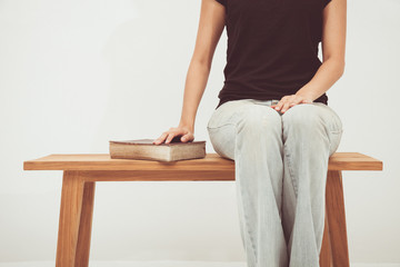 Wall Mural - woman holding a bible in her hands