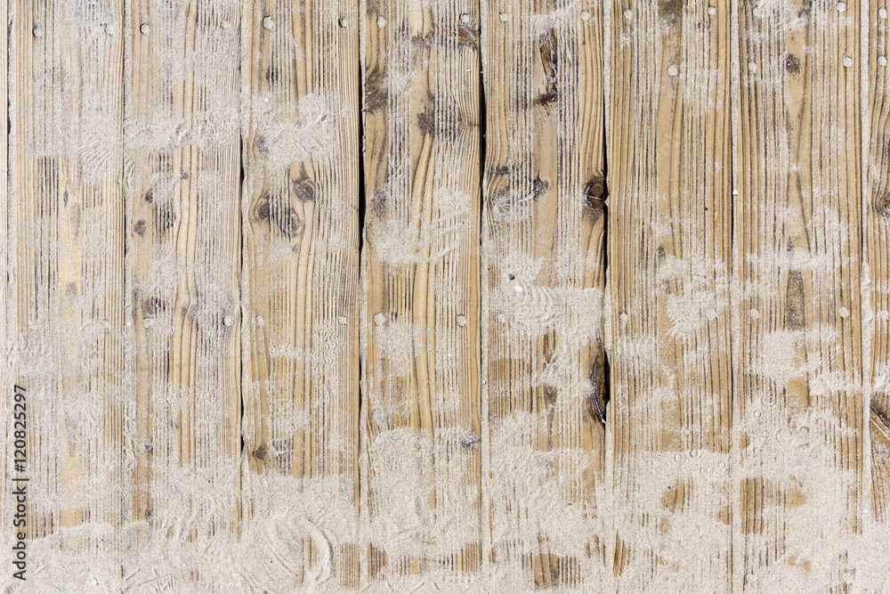 Beach sand on vintage planked wood background - layout with free text space. - obrazy, fototapety, plakaty 
