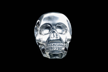 Mysterious glowing crystal skull on a black background