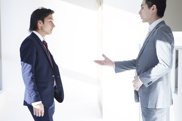 Wall Mural - Businessmen are stand talking in the office