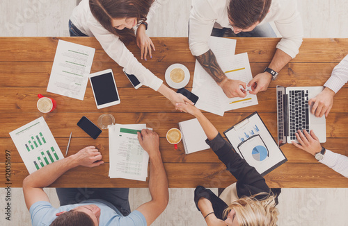 Fotografie, Obraz Business people group handshake in office, top view