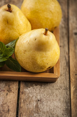 Wall Mural - Fruit background. Fresh organic pears on old wood. Pear autumn harvest