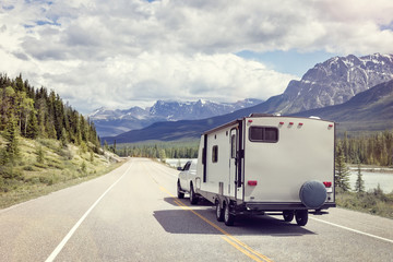 Wall Mural - Caravan or motor home trailer on a mountain road