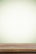 © mangpor2004 - Empty wooden table over cement wall  background