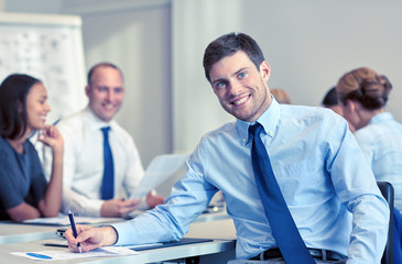 Sticker - group of smiling businesspeople meeting in office