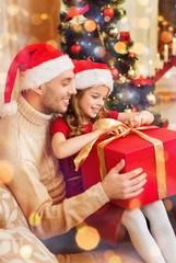 Poster - smiling father and daughter opening gift box