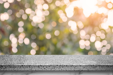 Poster - Empty marble table with bokeh abstract green background.