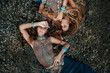 © zolotareva_elina - Two beautiful boho girls in ethnic jewelry outdoors. Top view