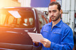 © Production Perig - Young attractive mechanic working at the garage